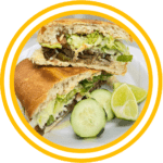 Tortas - Homemade bread with refried beans, jalapeño, tomato, lettuce, avocado, onion, mayonnaise, cheese, and meat of your choice.